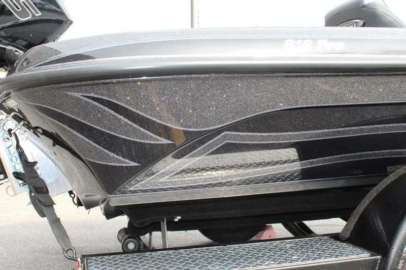 Slide: The Image of 2027 Phoenix 818 Pro boat with sleek black design and metallic accents. - 21
