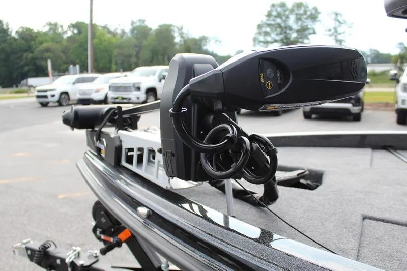 Slide: The Image of 2027 Phoenix 818 Pro boat with advanced trolling motor in a parking lot. - 8