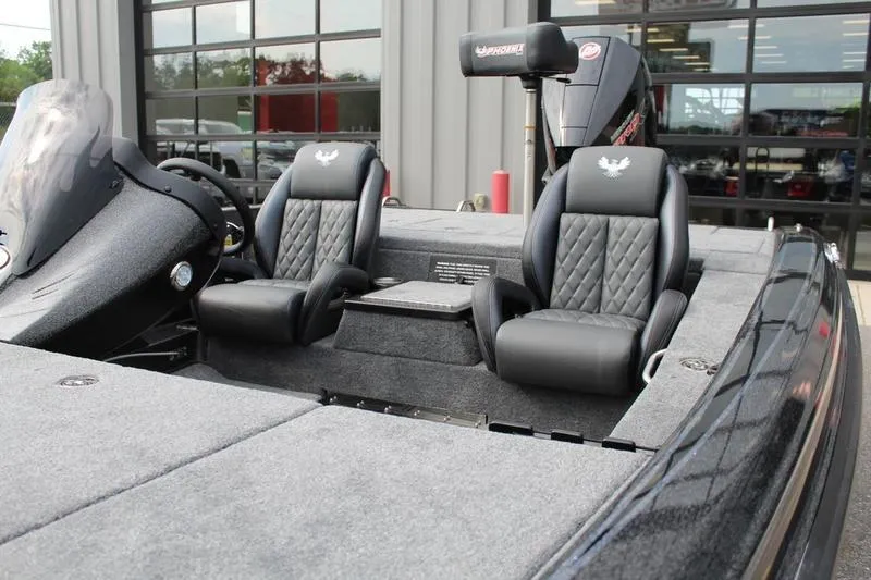 Slide: The Image of Interior of 2027 Phoenix 818 Pro boat with dual black seats and steering console. - 10