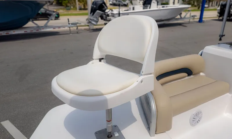 Slide: The Image of A white boat seat with padded backrest on a 2015 Hurricane FD 198. - 15