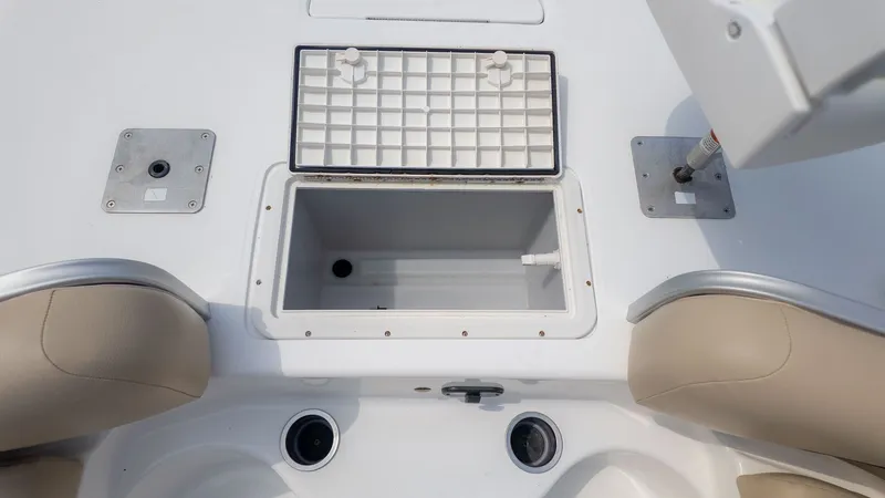 Slide: The Image of The image shows the interior of a 2015 Hurricane FD 198 boat with an open storage compartment. - 14