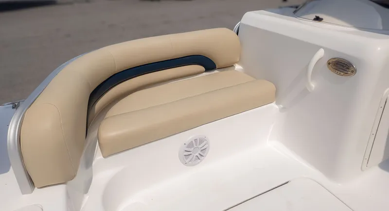 Slide: The Image of Beige seating with a blue accent line on a boat. - 14