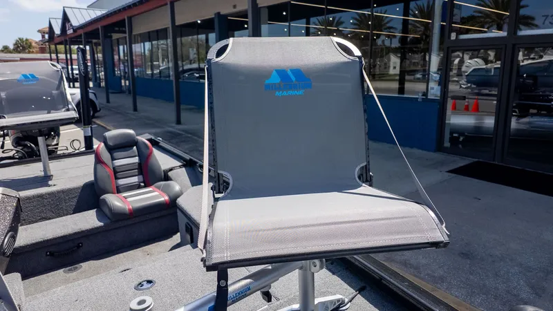 Slide: The Image of A gray boat seat on a 2023 Ranger RT178, parked in front of a building. - 14