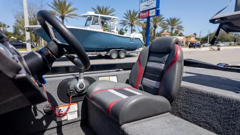 Slide: The Image of The image shows the cockpit of a Ranger RT178 boat with a gray and red seat. - 15
