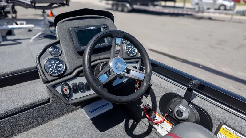 Slide: The Image of The image shows the cockpit of a Ranger RT178 boat with steering wheel and instruments. - 15