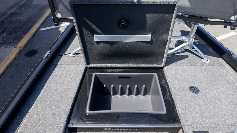 Slide: The Image of The image shows the storage compartment of a 2023 Ranger RT178 boat. - 10