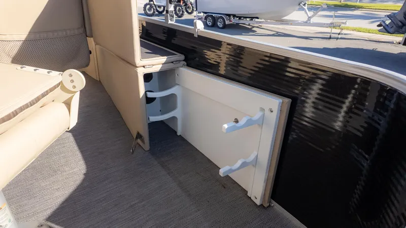Slide: The Image of Interior view of a 2022 Godfrey Sweetwater 2086 F with storage and seating area. - 7
