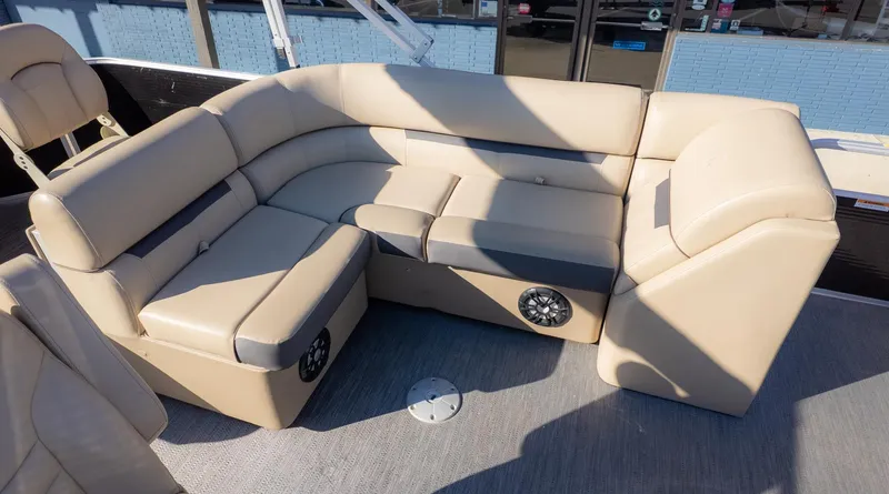 Slide: The Image of Interior of the Godfrey Sweetwater 2086 F with beige upholstery and speakers. - 12