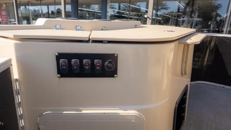 Slide: The Image of The image shows the dashboard of a 2022 Godfrey Sweetwater 2086 F boat. - 9