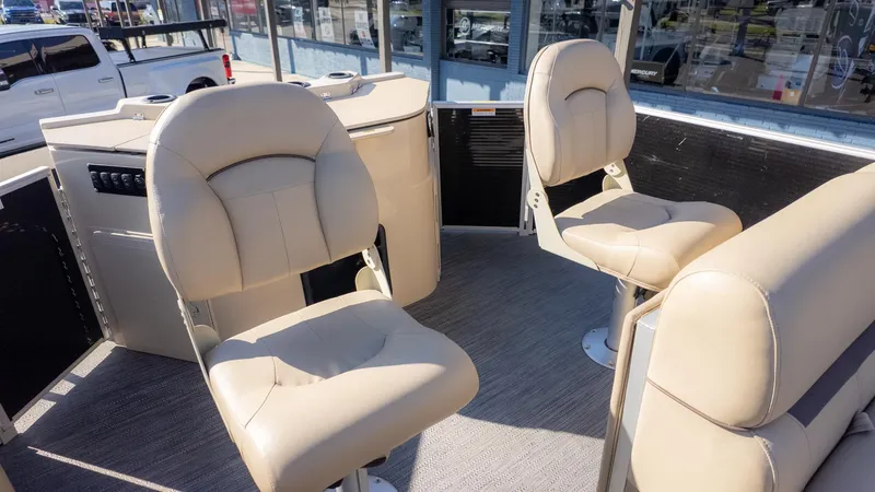 Slide: The Image of The image shows the interior of a 2022 Godfrey Sweetwater 2086 F with beige seats. - 7