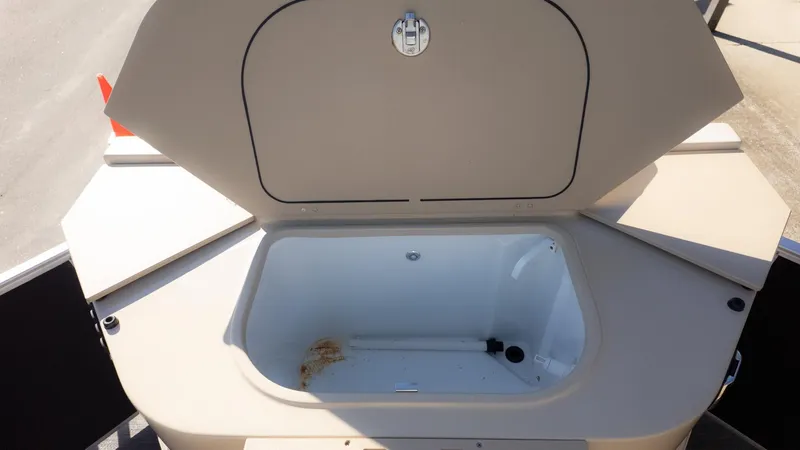 Slide: The Image of An open storage compartment on a 2022 Godfrey Sweetwater 2086 F boat. - 10