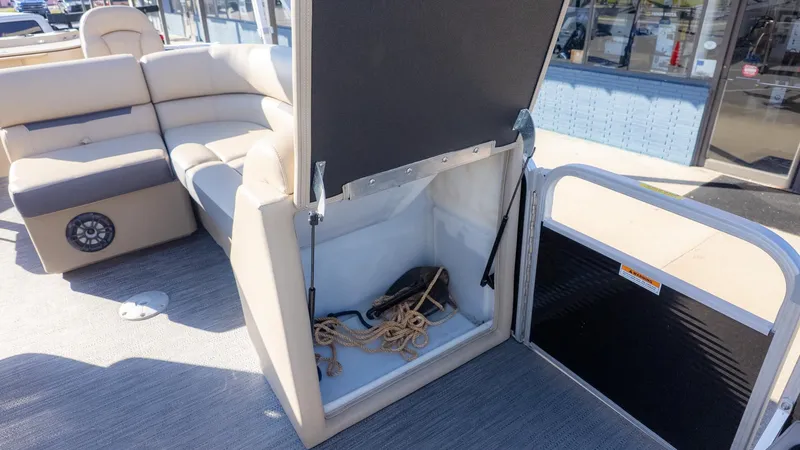 Slide: The Image of Interior of a 2022 Godfrey Sweetwater 2086 F with storage compartment and ropes. - 14