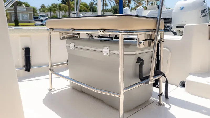 Slide: The Image of A modern boat seat with storage underneath, surrounded by a sunny setting. - 20