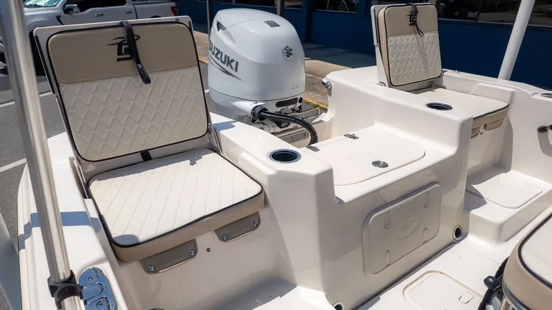 Slide: The Image of The image shows the cockpit of a Carolina Skiff 17 LS boat with a Suzuki outboard motor. - 4
