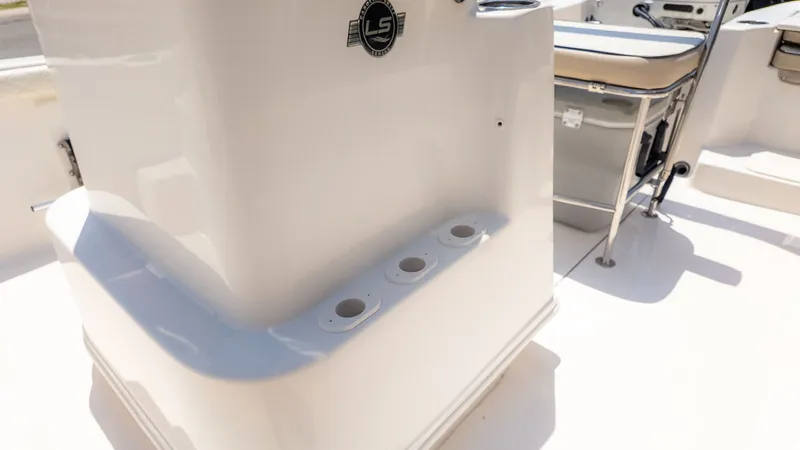 Slide: The Image of Close-up of the helm area on a 2023 Carolina Skiff 17 LS with cup holders. - 19