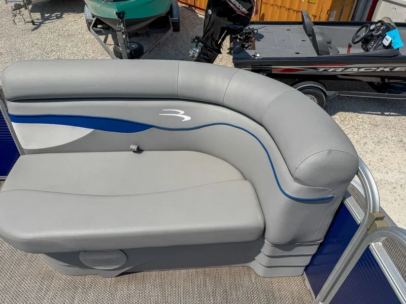 Slide: The Image of Gray seating on a boat with blue accents. - 9