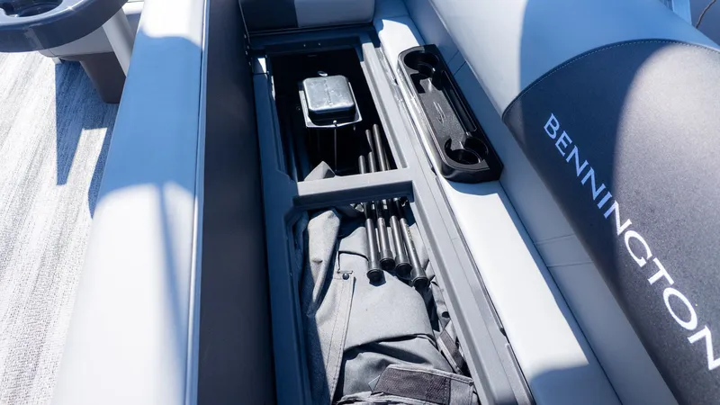 Slide: The Image of Interior view of a Bennington boat with storage for fishing gear. - 6