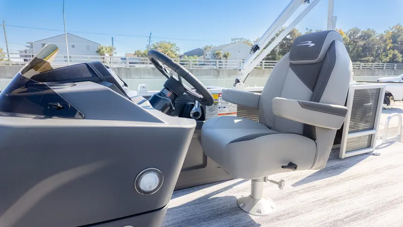 Slide: The Image of Bennington 18 S Fish and Cruise 2026: Modern helm with a comfortable captain's chair. - 13