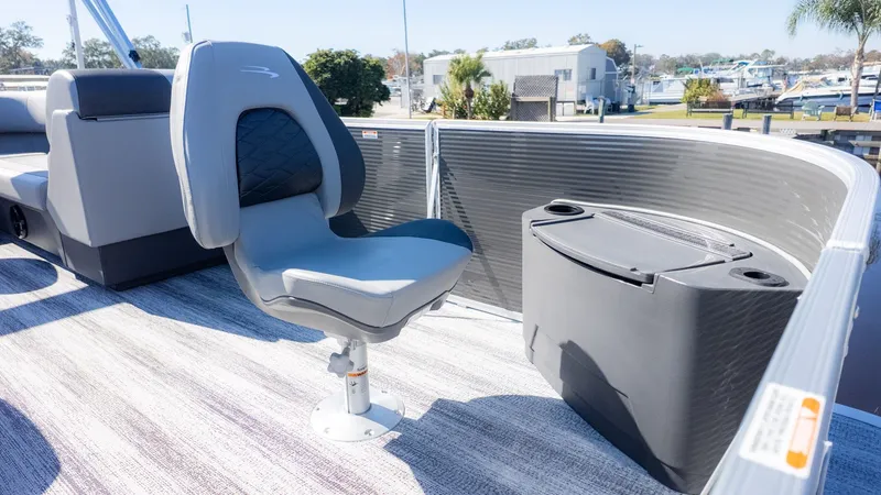 Slide: The Image of A modern seat on a Bennington 18 S Fish and Cruise boat, surrounded by sleek railing. - 8
