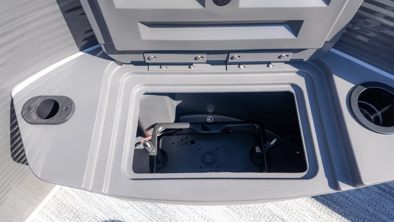 Slide: The Image of An open storage compartment on a Bennington 18 S Fish and Cruise boat. - 9