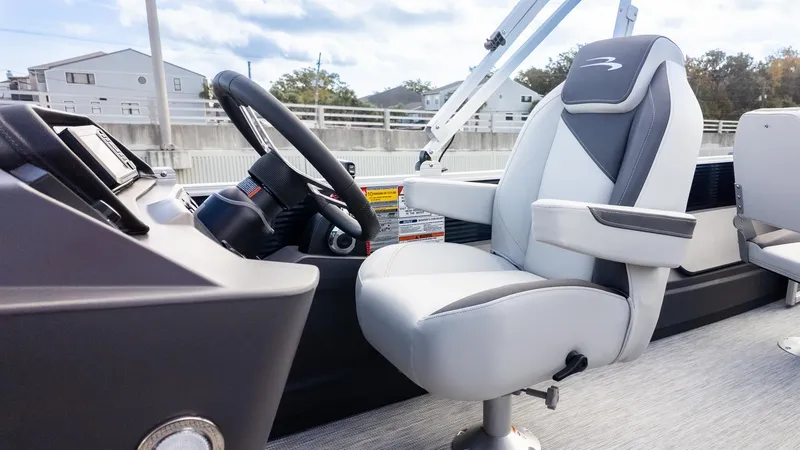 Slide: The Image of Interior view of a modern boat with a cushioned captain's chair and a helm station. - 19