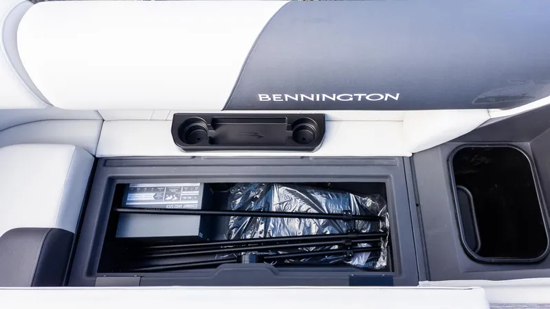 Slide: The Image of Interior view of a Bennington 20 S Fishing boat with storage compartment and cup holders. - 11