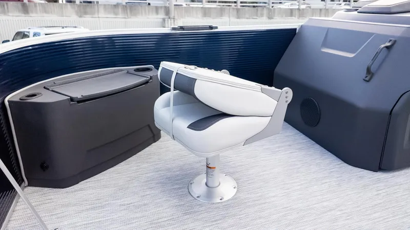 Slide: The Image of A sleek seat on a modern boat with gray flooring and blue accents. - 15