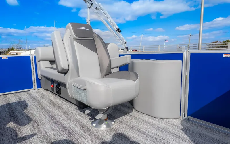 Slide: The Image of A modern seat on a Bennington 20SSRSE pontoon boat with blue railing and gray flooring. - 10