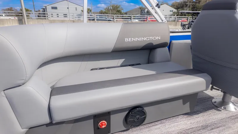 Slide: The Image of Gray seating on a Bennington boat with a speaker underneath. - 9