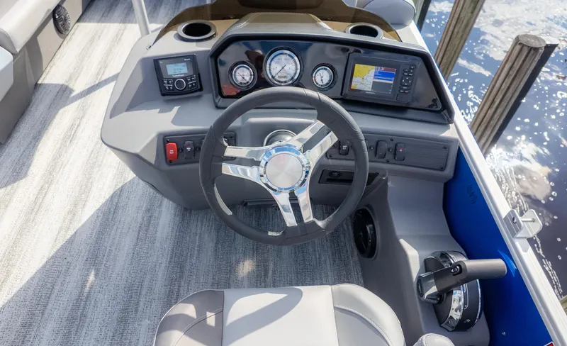 Slide: The Image of The image shows the helm of a 2025 Bennington 20SSRSE boat with modern instruments. - 18