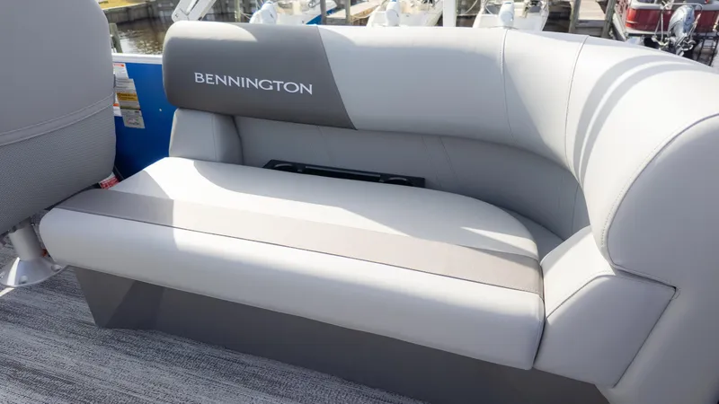 Slide: The Image of Seating area on a Bennington 20SSRSE boat, featuring gray upholstery and sleek design. - 5
