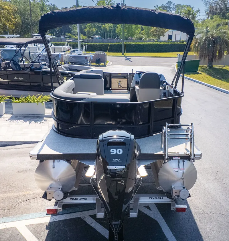 Slide: The Image of 2026 Barletta Sanza 20L on a trailer, featuring a Mercury 90 HP engine. - 4