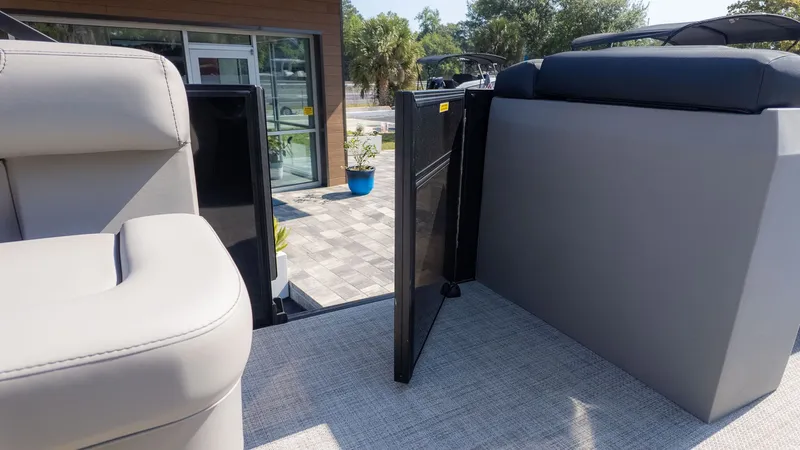 Slide: The Image of Interior of a Barletta Sanza 20L boat with gray seating and carpeted flooring. - 10