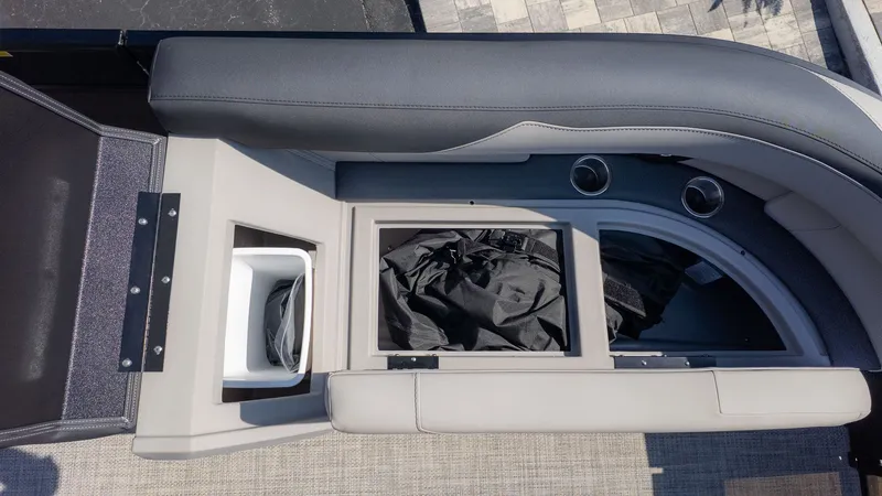 Slide: The Image of A seating area with storage underneath and two cup holders. - 12