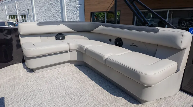 Slide: The Image of The image shows a luxurious, cream-colored seating area on a boat. - 5