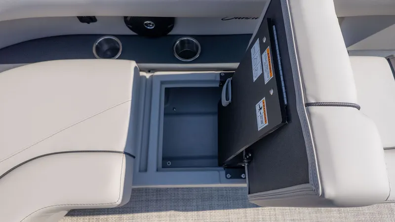 Slide: The Image of Close-up of a seating area with storage and cup holders on a Barletta Sanza 20L boat. - 8