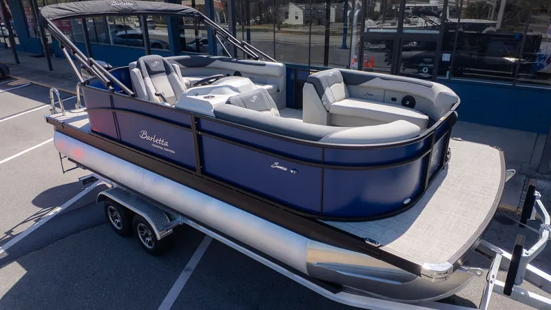 The Image of The image shows a 2026 Barletta Sanza 20L pontoon boat on a trailer. - 1