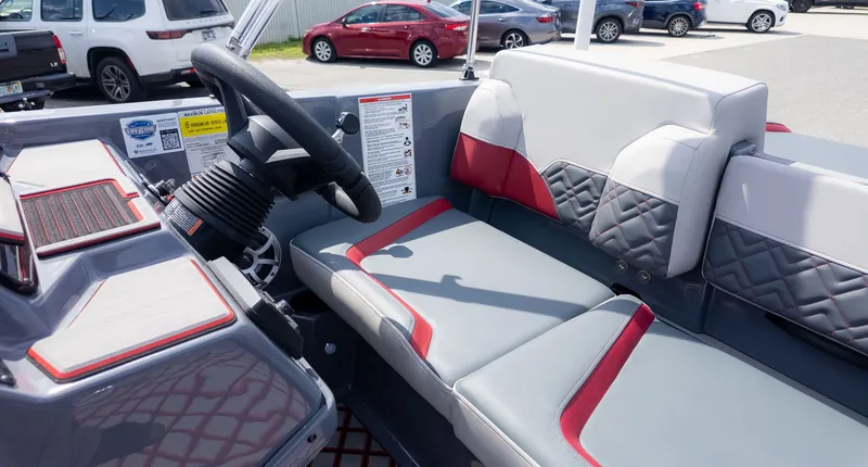 Slide: The Image of The image shows the cockpit of a 2027 Starcraft J7 Jet Super Sport with gray and red seating. - 10