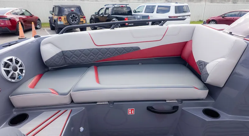 Slide: The Image of The image shows the gray and red upholstery of a 2027 Starcraft J7 JET SUPER SPORT. - 8