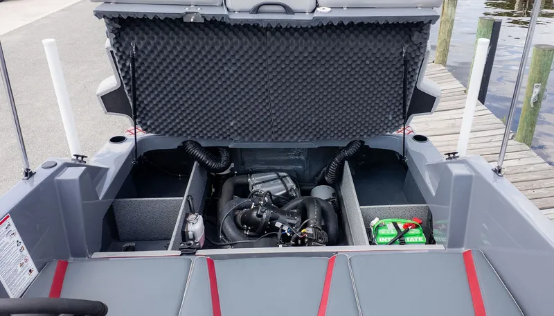 Slide: The Image of Engine compartment of a Starcraft J7 Jet Super Sport boat at the dock. - 12