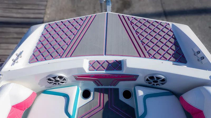 Slide: The Image of The image shows the deck of a Starcraft J7 Jet Super Sport boat with colorful upholstery. - 8