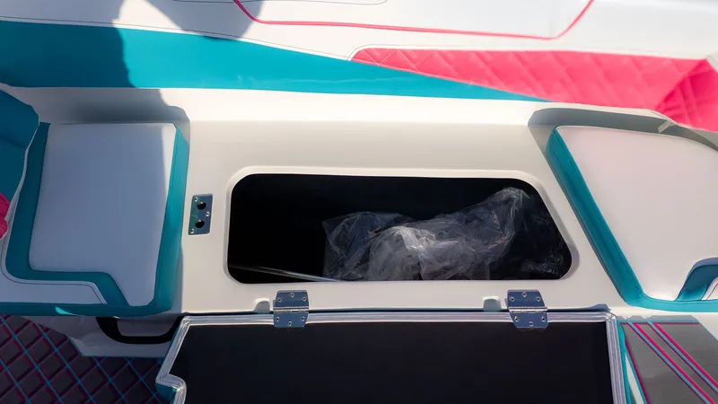 Slide: The Image of Interior view of a boat with storage compartment and colorful upholstery. - 6