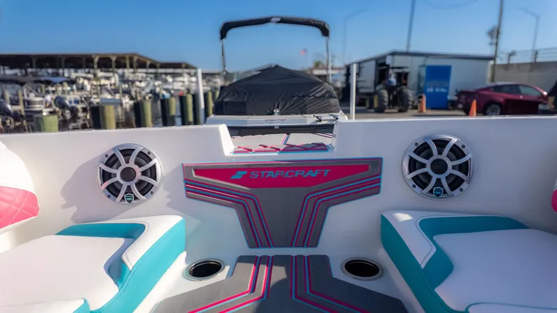Slide: The Image of The image shows the interior of a Starcraft J7 Jet Super Sport boat with modern seating and speakers. - 7