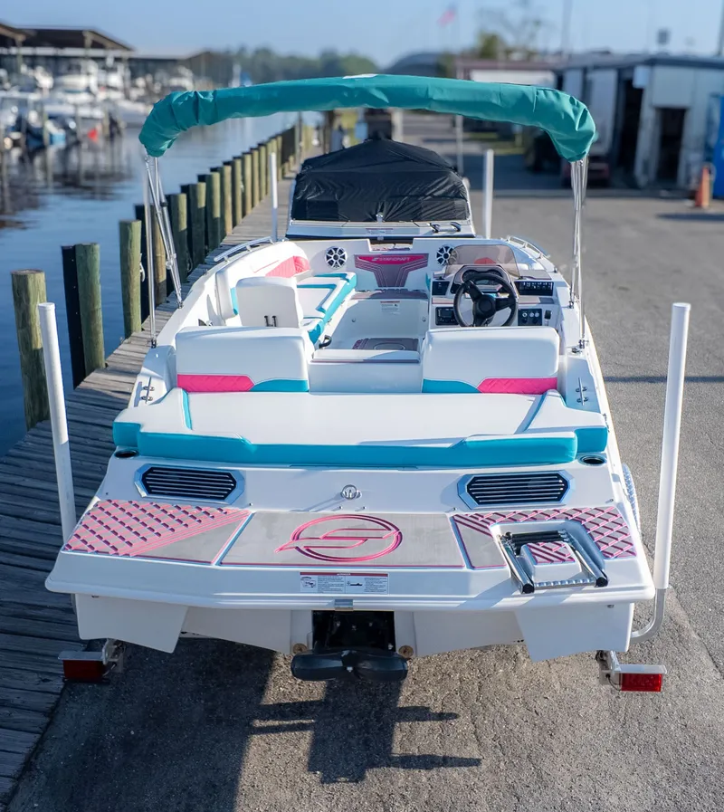 The Image of Starcraft J7 JET SUPER SPORT 2027 at dock with colorful seating and steering wheel. - 1