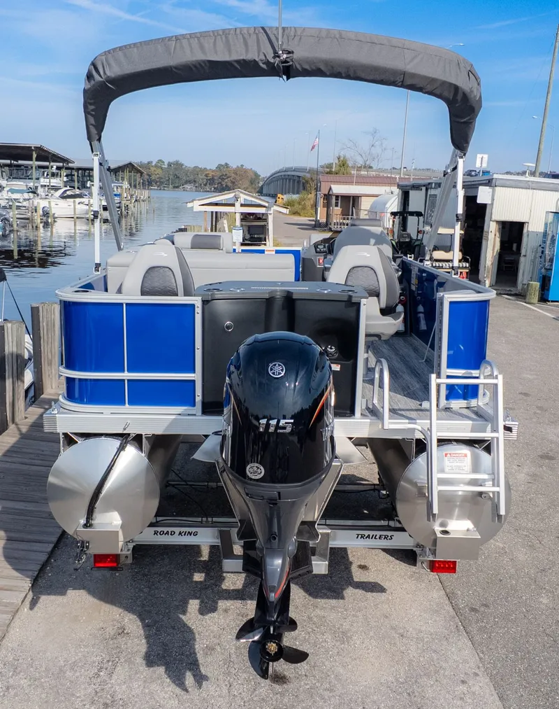 The Image of Bennington 21 S Fish and Cruise 2026 at dock with outboard motor. - 1