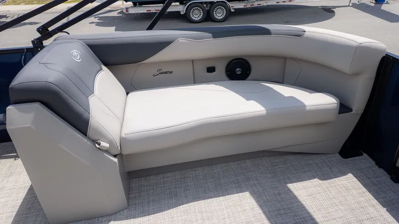 Slide: The Image of The image shows an elegant bench seat on a boat with gray and black upholstery. - 6