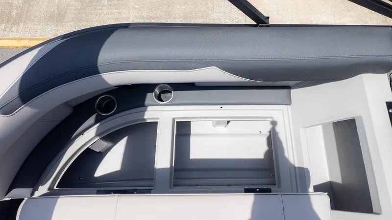 Slide: The Image of Interior view of a Barletta SANZA 22QC boat with gray upholstery and cup holders. - 12