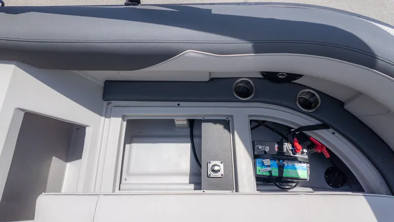 Slide: The Image of Seating area with battery compartment and cup holders on a Barletta SANZA 22QC boat. - 8