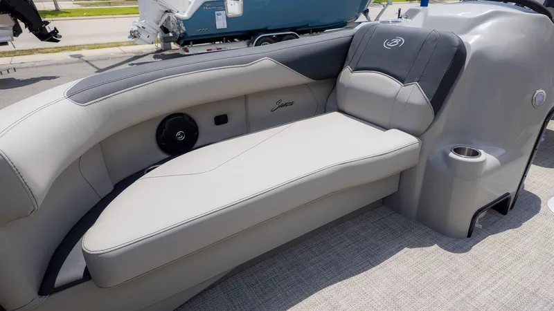Slide: The Image of The image shows the gray and black seating of a Barletta SANZA 22QC boat. - 19
