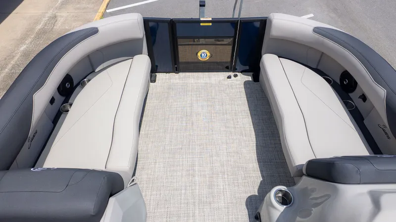 Slide: The Image of The image shows the spacious deck of a Barletta SANZA 22QC boat with comfortable seating. - 16
